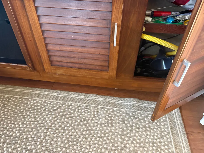 Slide: The Image of Open wooden cabinet on Mainship 34 Mark III, year 1983. - 33