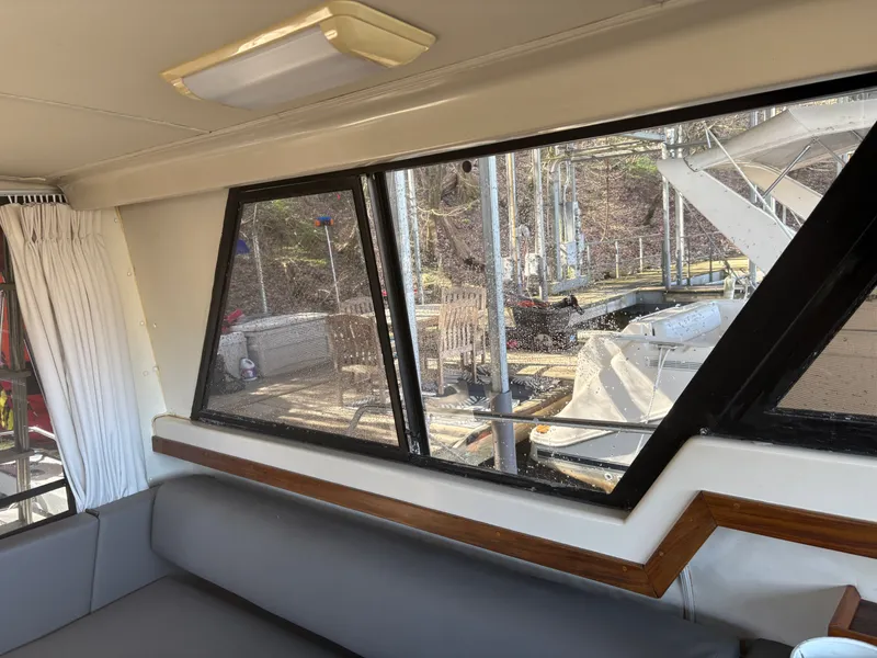 Slide: The Image of Interior of a 1983 Mainship 34 Mark III yacht with harbor view. - 34