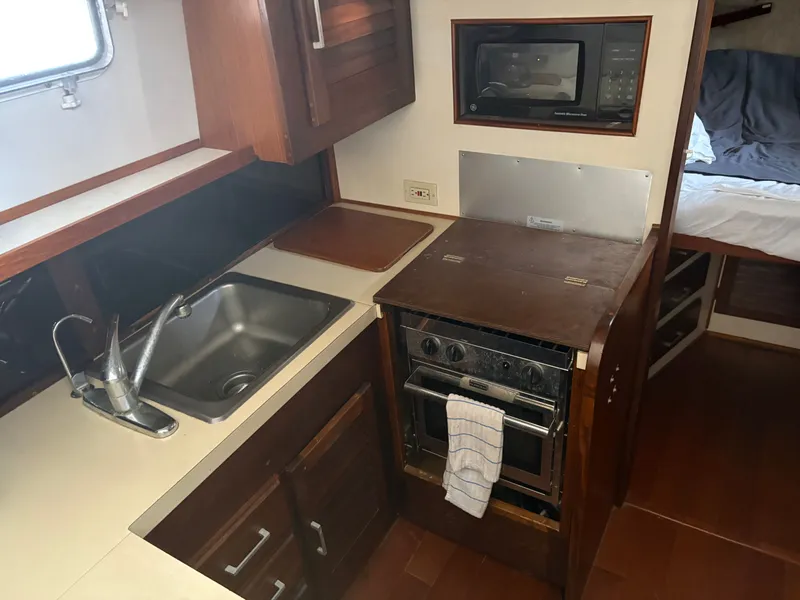 Slide: The Image of Galley area on a 1983 Mainship 34 Mark III boat. - 44