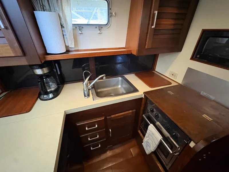 Slide: The Image of Galley area on a 1983 Mainship 34 Mark III boat. - 46