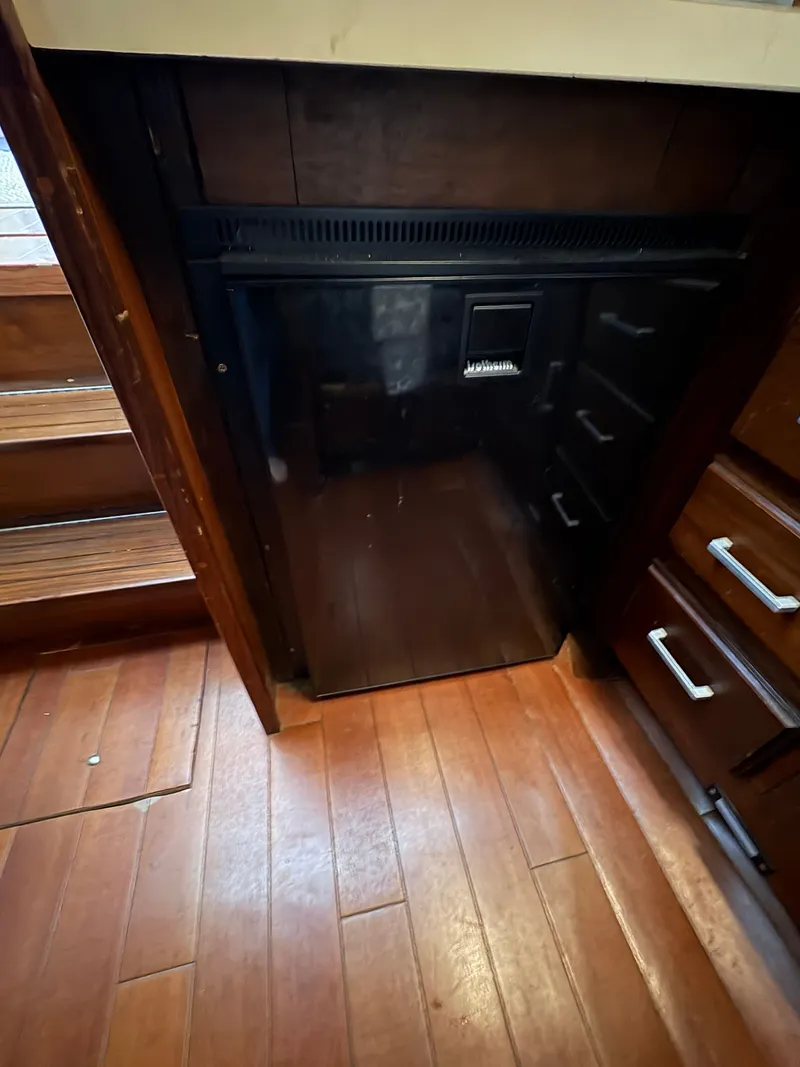 Slide: The Image of 1983 Mainship 34 Mark III kitchen area with refrigerator. - 48