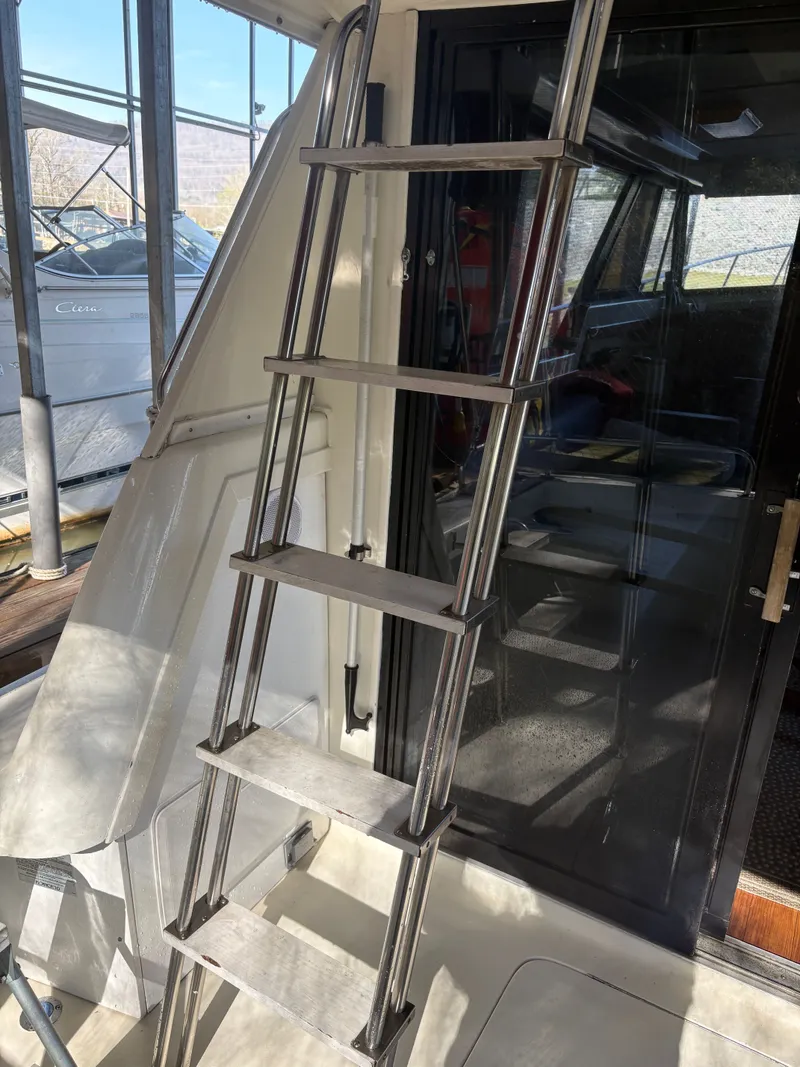 Slide: The Image of Metal ladder on a 1983 Mainship 34 Mark III boat. - 9