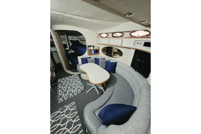 Slide: The Image of Luxurious interior of a 1994 Sea Ray 400 Express Cruiser with elegant seating and decor. - 20