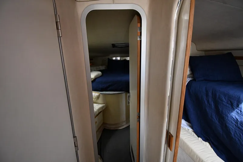 Slide: The Image of Interior of 1994 Sea Ray 400 Express Cruiser with cozy sleeping quarters. - 24