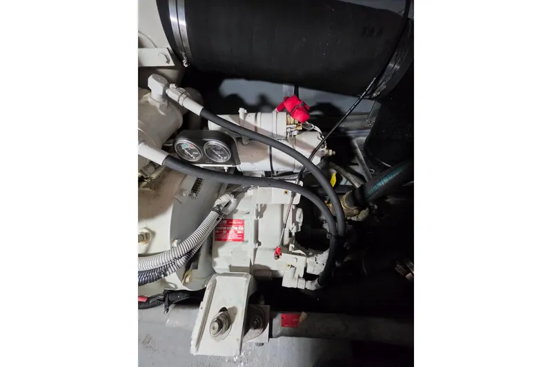 Slide: The Image of Engine compartment of a 1994 Sea Ray 400 Express Cruiser, showcasing mechanical components. - 28