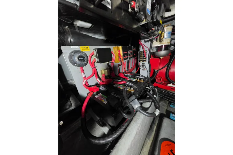 Slide: The Image of Engine compartment of a 1994 Sea Ray 400 Express Cruiser with wiring and components. - 29