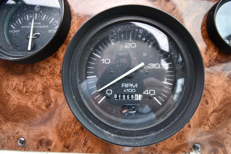 Slide: The Image of Close-up of 1994 Sea Ray 400 Express Cruiser RPM gauge on wooden dashboard. - 13