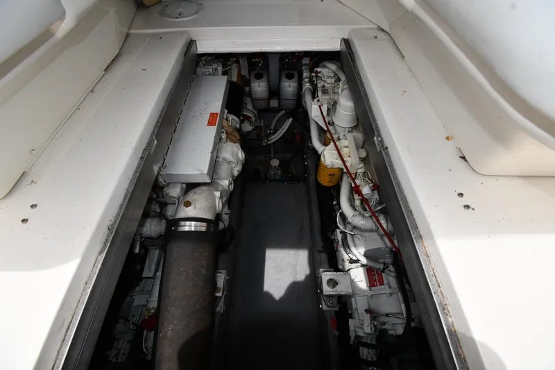 Slide: The Image of Engine compartment of a 1994 Sea Ray 400 Express Cruiser, showcasing mechanical components. - 42