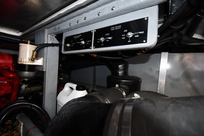 Slide: The Image of Engine room of 1994 Sea Ray 400 Express Cruiser, showcasing fuel system components. - 47