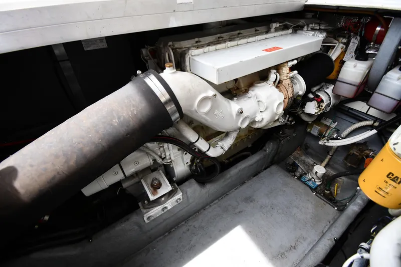 Slide: The Image of Engine compartment of a 1994 Sea Ray 400 Express Cruiser, showcasing mechanical components. - 44
