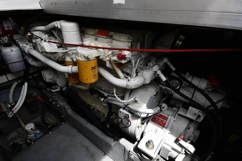 Slide: The Image of Engine compartment of a 1994 Sea Ray 400 Express Cruiser, showcasing mechanical components. - 43