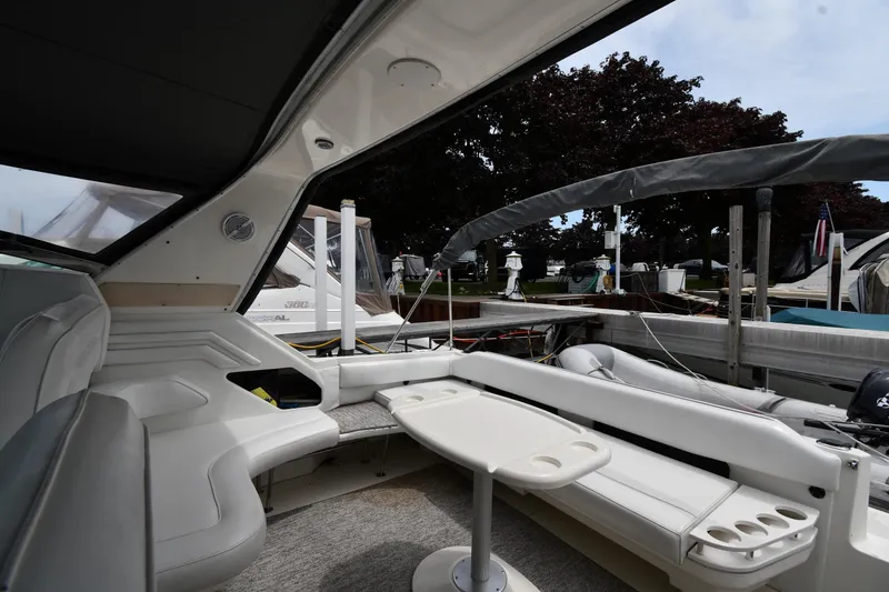 Slide: The Image of Interior view of a 1994 Sea Ray 400 Express Cruiser at a marina dock. - 19