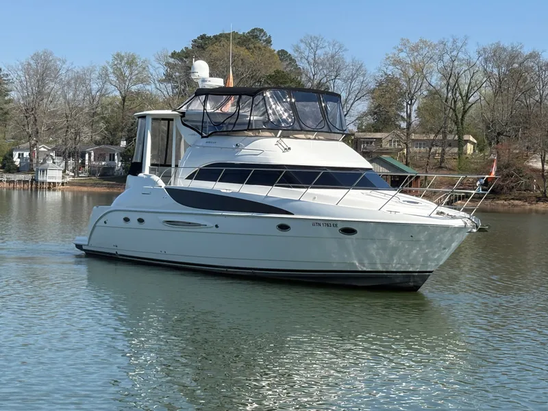 Slide: The Image of 2007 Meridian 459 Motoryacht anchored on a calm lake. - 1