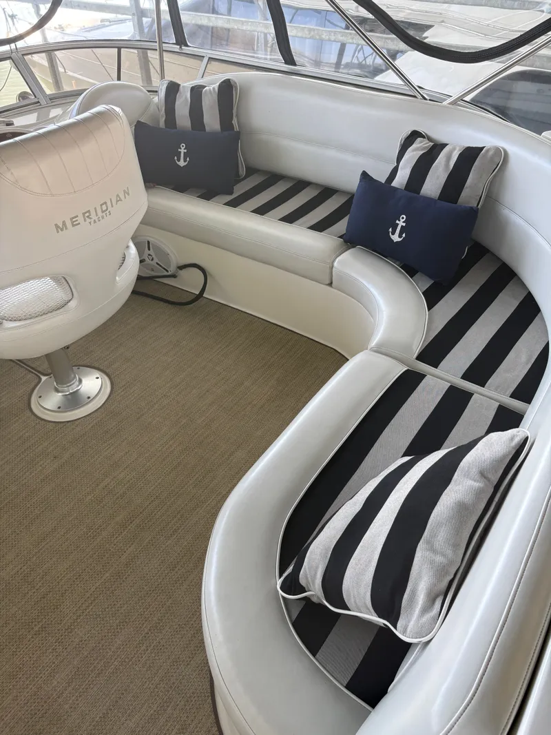 Slide: The Image of Interior of a 2007 Meridian 459 Motoryacht with striped cushions. - 11