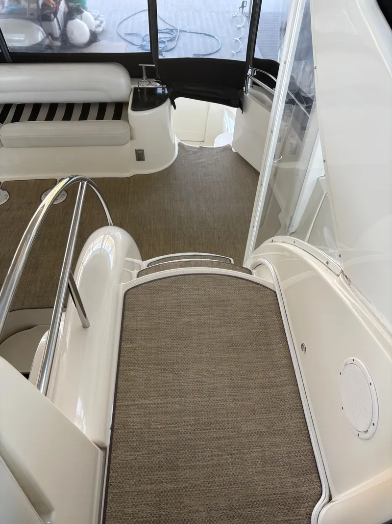 Slide: The Image of Interior of a 2007 Meridian 459 Motoryacht with stairs and seating area. - 18