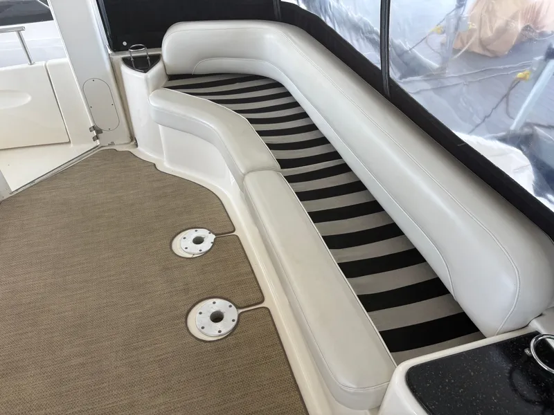 Slide: The Image of Interior of a 2007 Meridian 459 Motoryacht with cushioned seating. - 19
