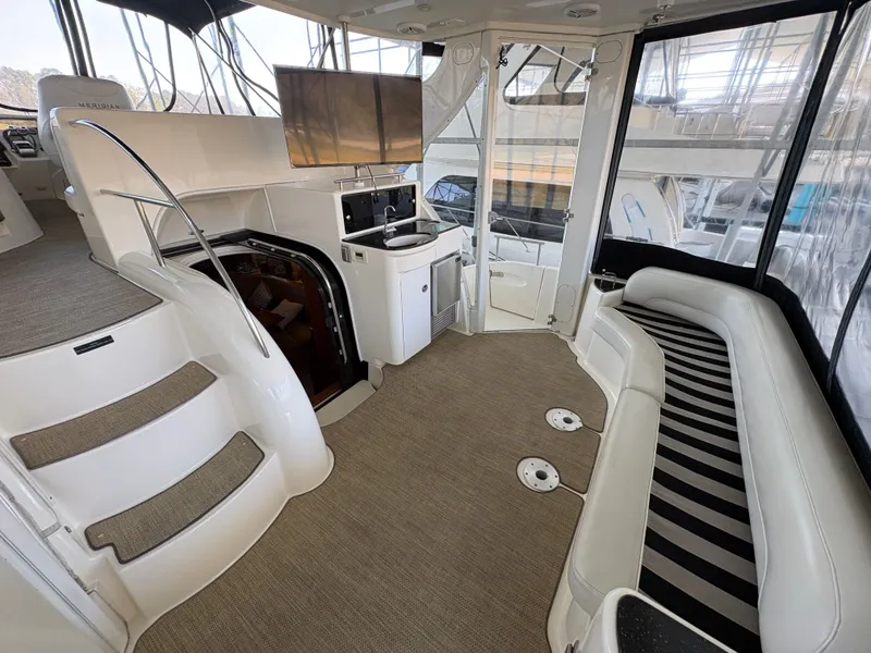 Slide: The Image of Interior of a 2007 Meridian 459 Motoryacht with seating area and stairs. - 20