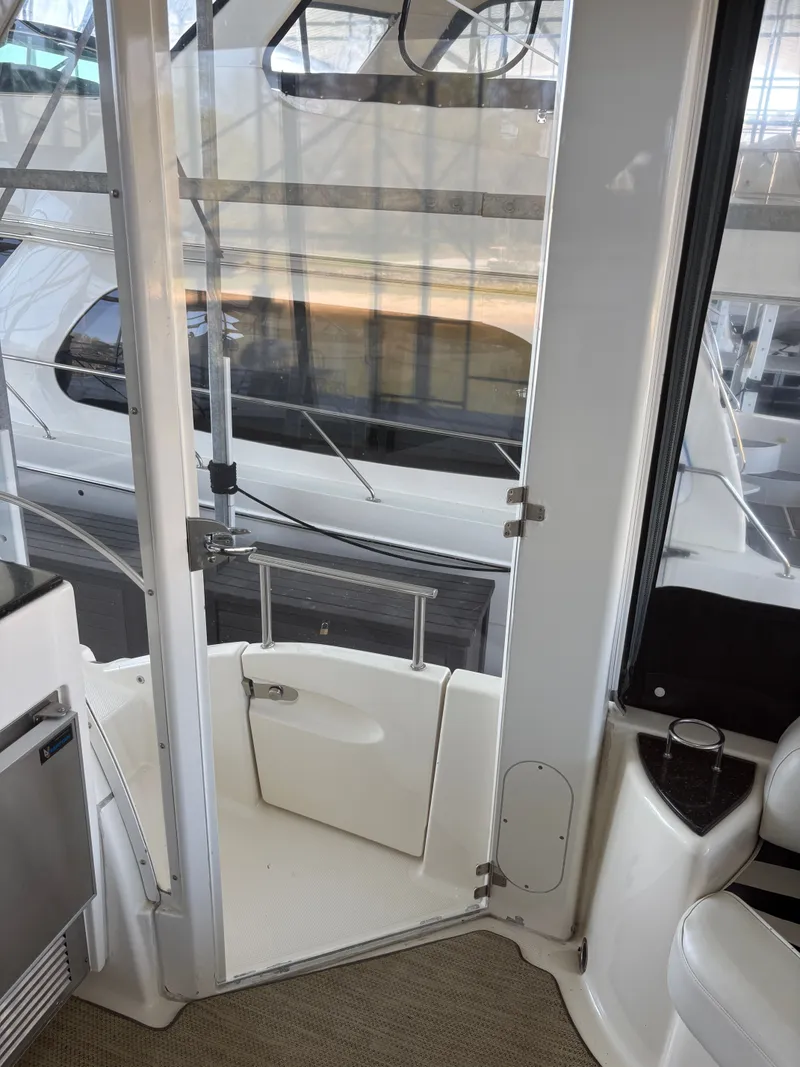 Slide: The Image of Interior of a 2007 Meridian 459 Motoryacht with open door. - 24