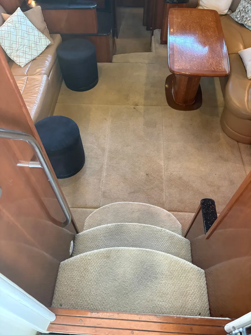 Slide: The Image of Interior of 2007 Meridian 459 Motoryacht with carpeted floor and wooden furniture. - 26