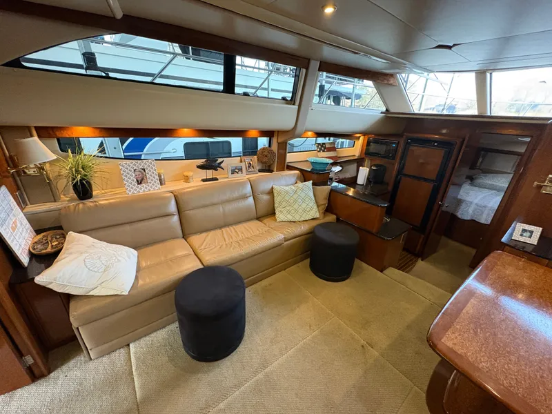 Slide: The Image of Interior of a 2007 Meridian 459 Motoryacht with leather sofa and wooden furnishings. - 28