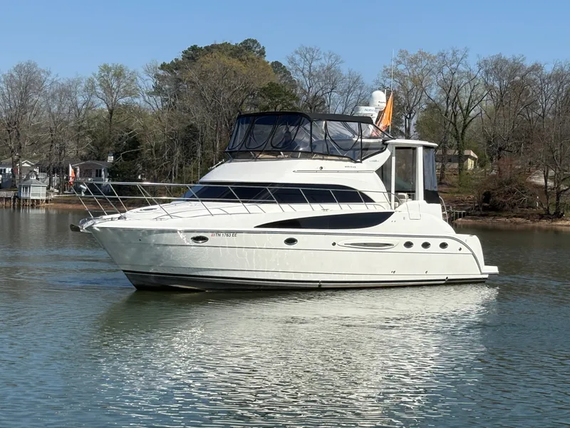 Slide: The Image of 2007 Meridian 459 Motoryacht anchored on calm water. - 3