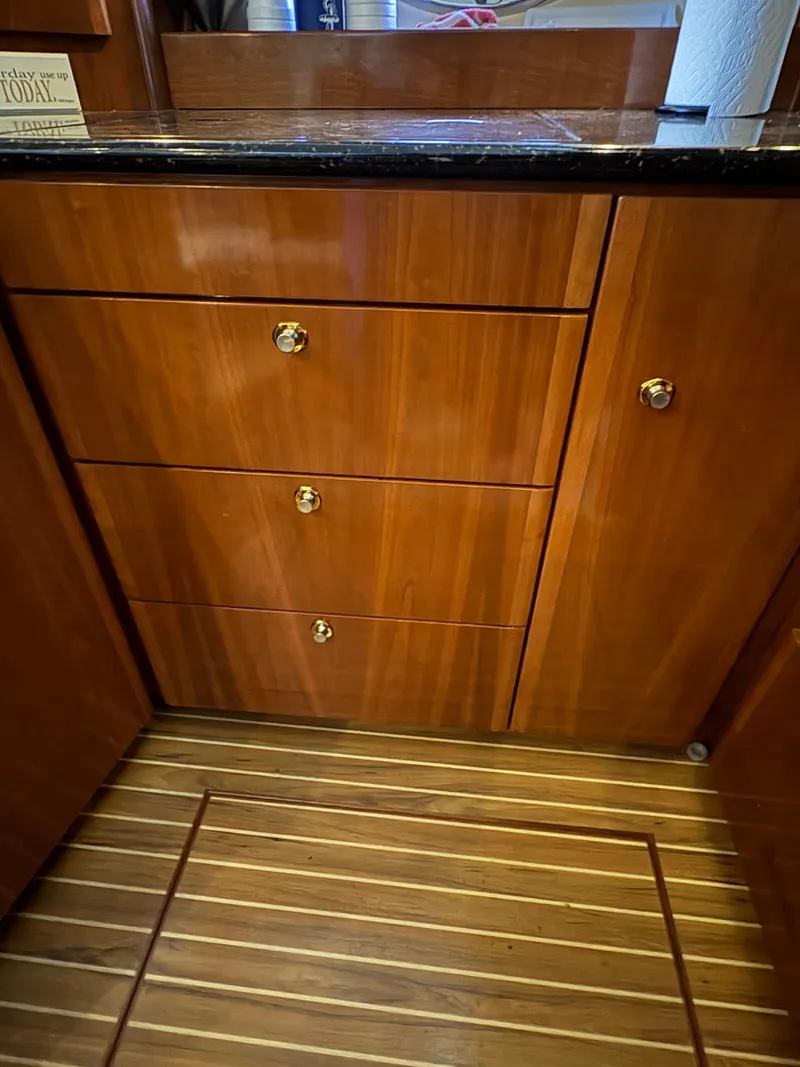Slide: The Image of Wooden cabinets and flooring in a 2007 Meridian 459 Motoryacht. - 34