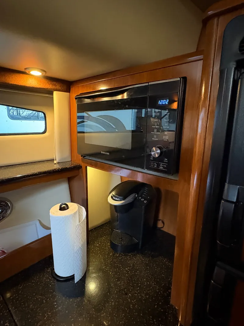 Slide: The Image of 2007 Meridian 459 Motoryacht kitchen area with microwave and coffee maker. - 36