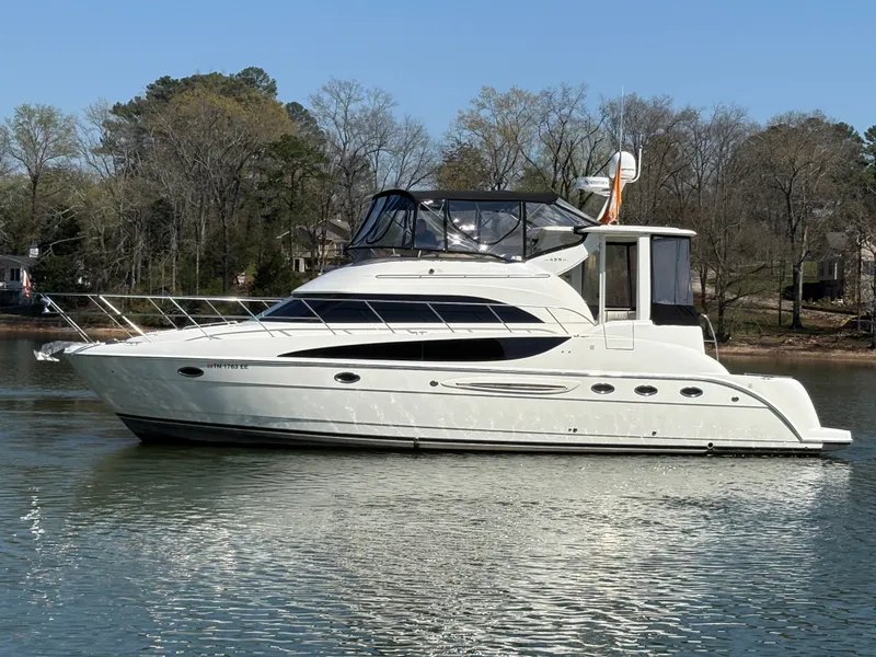 Slide: The Image of 2007 Meridian 459 Motoryacht on calm water with trees in background. - 4