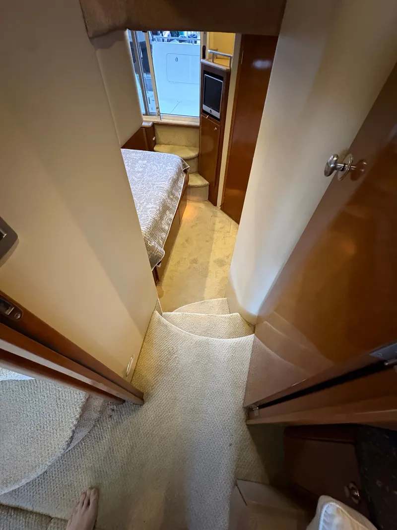 Slide: The Image of Interior of a 2007 Meridian 459 Motoryacht with stairs and sleeping area. - 40