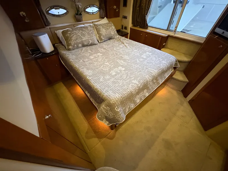 Slide: The Image of Interior of a 2007 Meridian 459 Motoryacht featuring a cozy bedroom. - 41