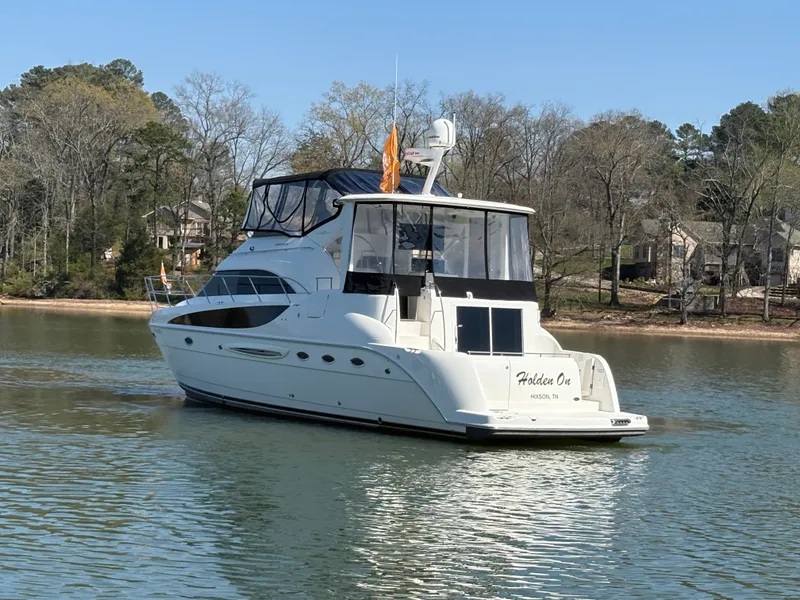 Slide: The Image of 2007 Meridian 459 Motoryacht anchored on a tranquil lake. - 6