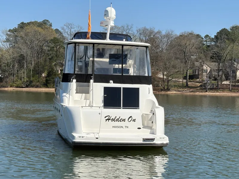 Slide: The Image of 2007 Meridian 459 Motoryacht anchored on a calm lake. - 7