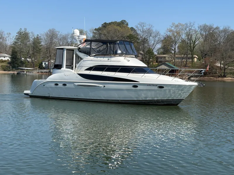 Slide: The Image of 2007 Meridian 459 Motoryacht anchored on calm water. - 8