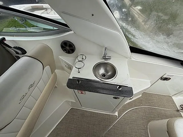 Slide: The Image of Interior of 2013 Sea Ray 260 Sundancer with sink and seating area. - 11