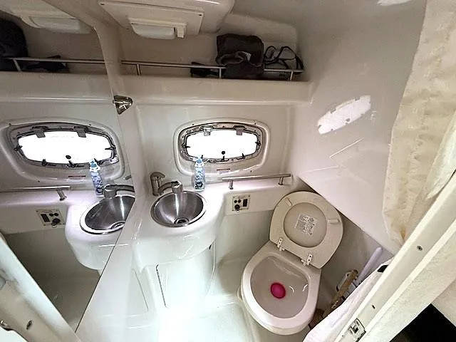 Slide: The Image of Bathroom interior of 2013 Sea Ray 260 Sundancer boat with sink and toilet. - 19