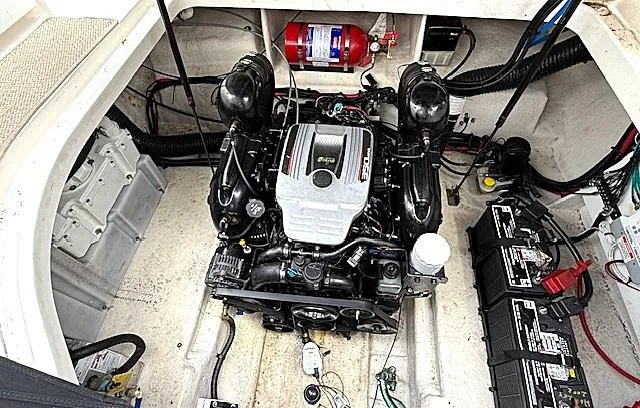 Slide: The Image of Engine compartment of a 2013 Sea Ray 260 Sundancer boat, featuring a well-maintained engine. - 20