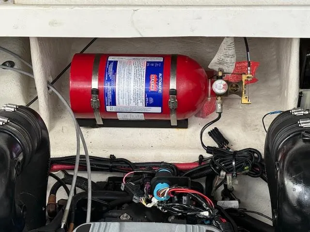 Slide: The Image of Engine compartment of 2013 Sea Ray 260 Sundancer with fire extinguisher system. - 22