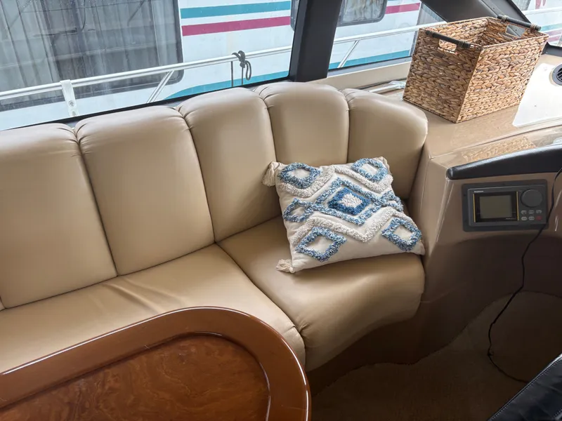 Slide: The Image of Interior of Carver 530 Voyager Pilothouse, leather sofa with cushion. - 16