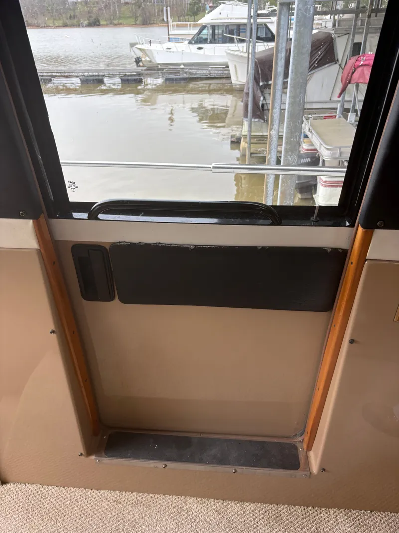 Slide: The Image of Interior view of 2000 Carver 530 Voyager Pilothouse overlooking marina. - 18