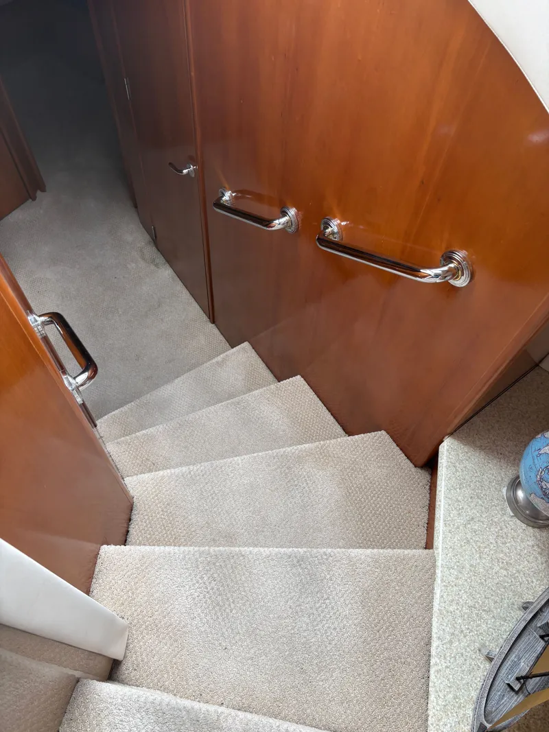 Slide: The Image of Staircase in 2000 Carver 530 Voyager Pilothouse, carpeted with wood paneling. - 19