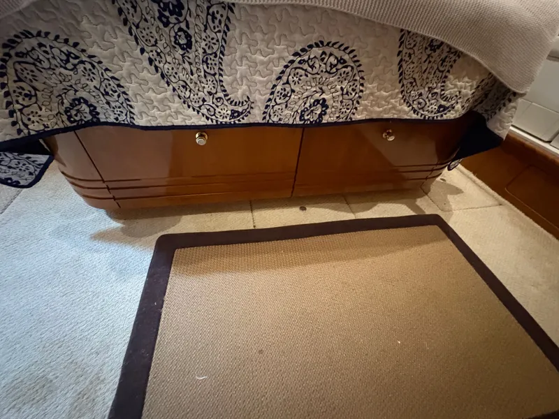 Slide: The Image of Interior of Carver 530 Voyager Pilothouse, bed with storage underneath. - 22