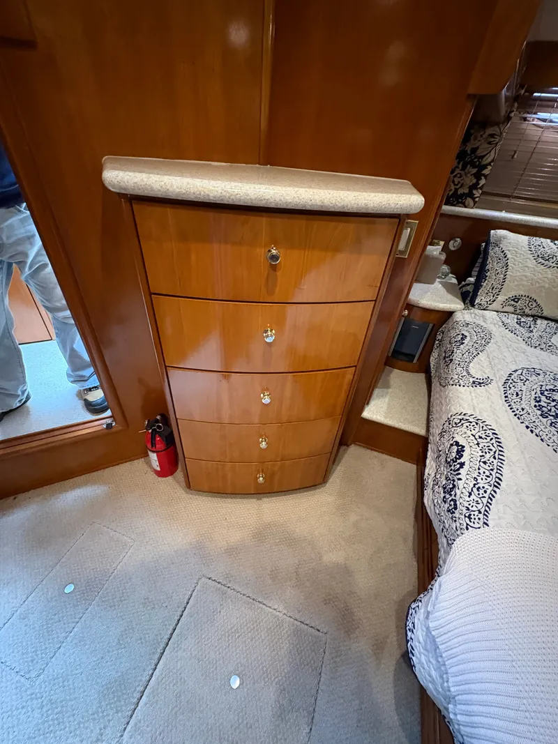 Slide: The Image of Interior of 2000 Carver 530 Voyager Pilothouse with wooden furniture. - 24