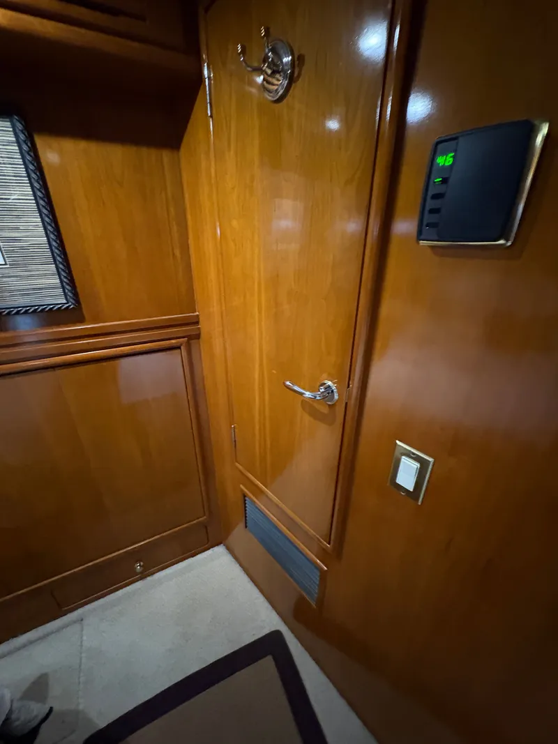 Slide: The Image of Interior of 2000 Carver 530 Voyager Pilothouse with wooden doors. - 27