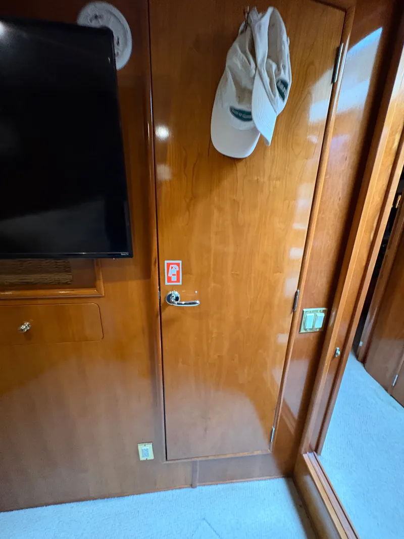 Slide: The Image of Interior of 2000 Carver 530 Voyager Pilothouse with wooden door and TV. - 30