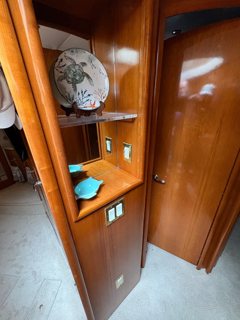 Slide: The Image of Interior of Carver 530 Voyager Pilothouse, wood cabinetry and decorative ceramics. - 40