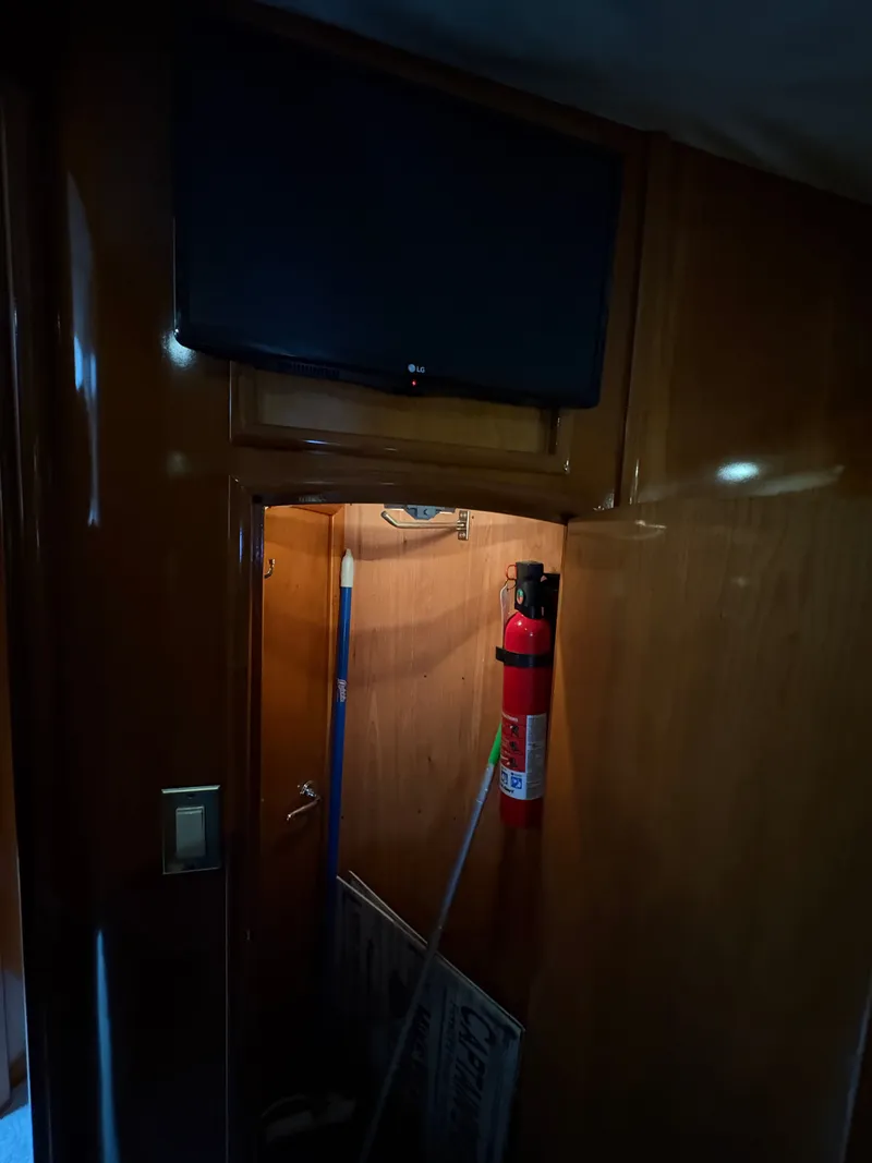 Slide: The Image of Interior of Carver 530 Voyager Pilothouse with fire extinguisher, year 2000. - 47