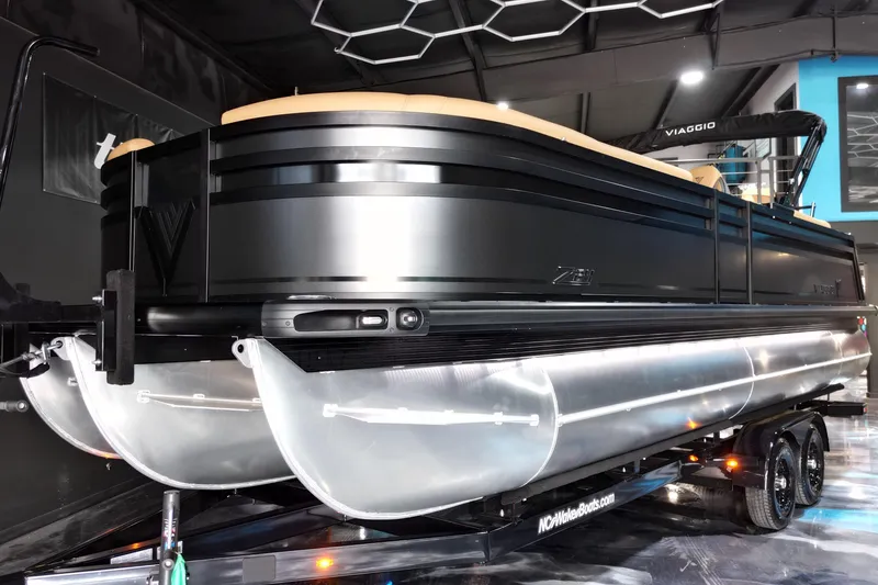 Slide: The Image of 2026 Viaggio Lago Z-U 24 pontoon boat on trailer in showroom setting. - 20