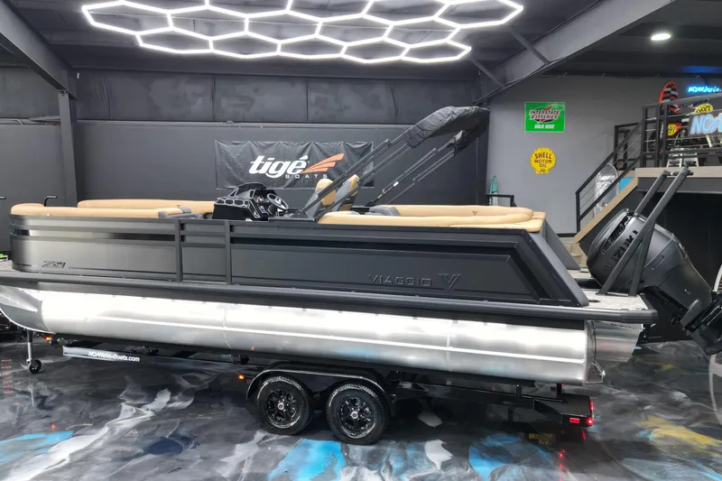 Slide: The Image of 2026 Viaggio Lago Z-U 24 pontoon boat in showroom with modern lighting. - 3