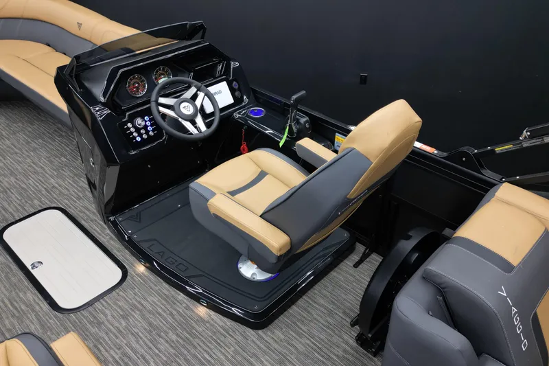 Slide: The Image of Captain's seat and dashboard of 2026 Viaggio Lago Z-U 24 boat, featuring modern controls. - 8