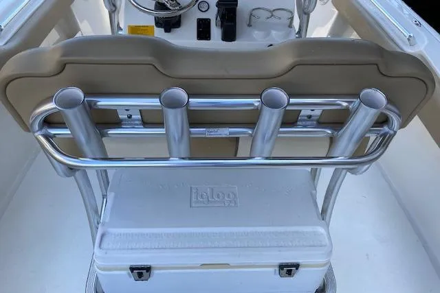 Slide: The Image of 2017 Key West 239 FS boat interior with rod holders and Igloo cooler. - 2